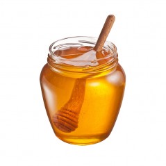 drewniana łyżka do miodu w słoiku miodu