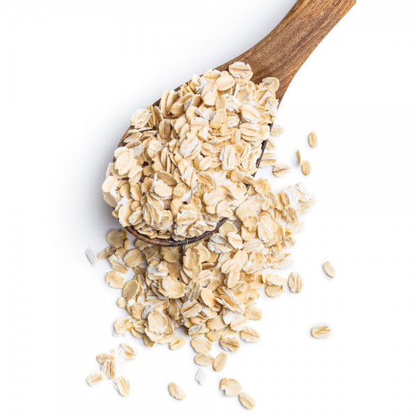 płatki owsiane na drewnianej łyżce